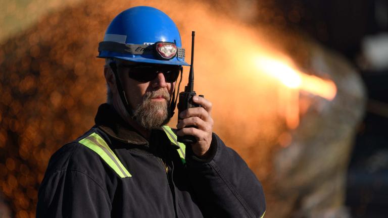 Enviri worker with a walkie talkie